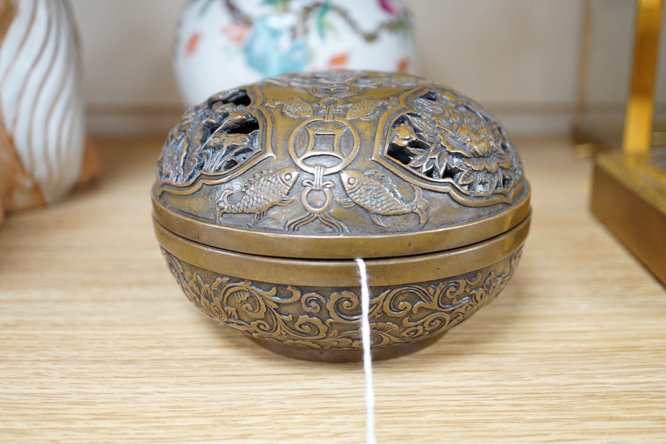 A Chinese circular carved bronze censer, 13.5cm diameter